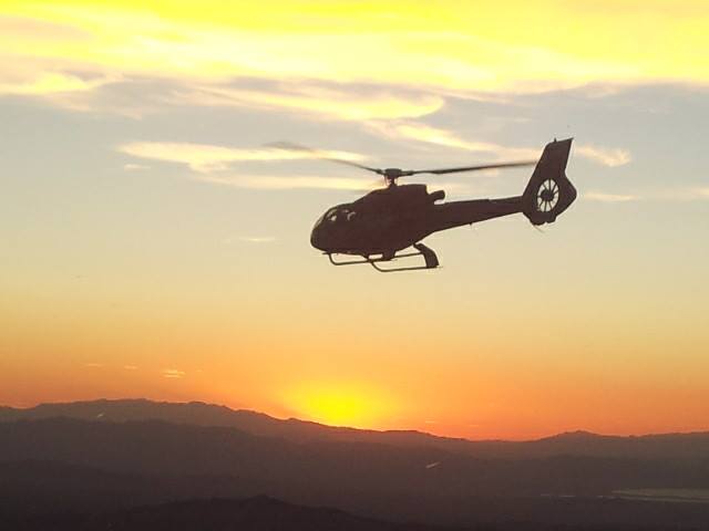 Following another helicopter back at sunset.