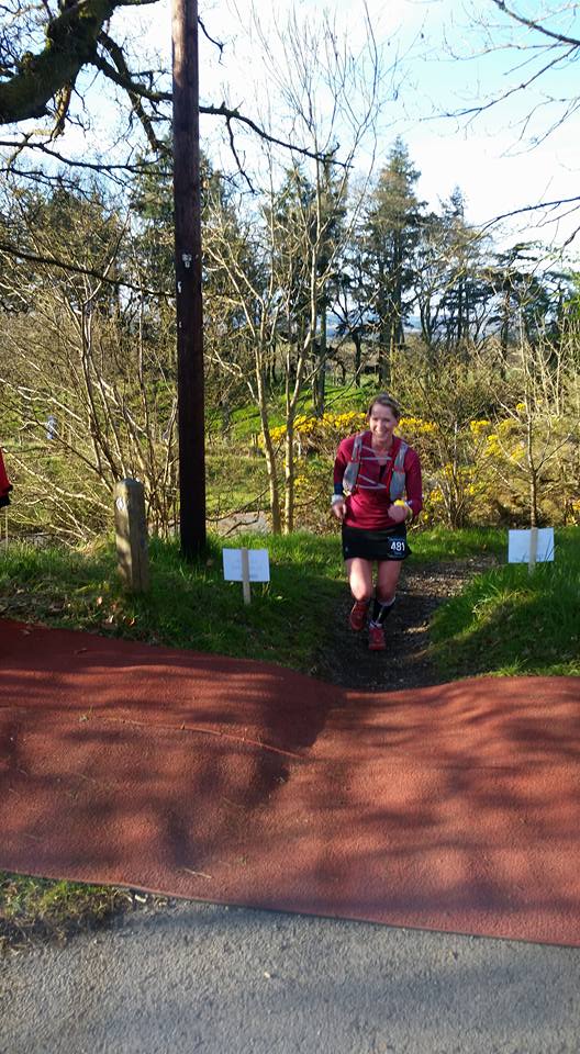 Drymen check point and grinning like a Cheshire cat. My face hurt by the end of the race! Photo - Lee McKemmie